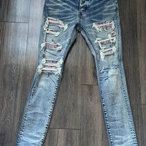 AMIRI Blue Distressed Skinny Jeans